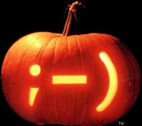 a carved pumpkin with an emoticive face on it