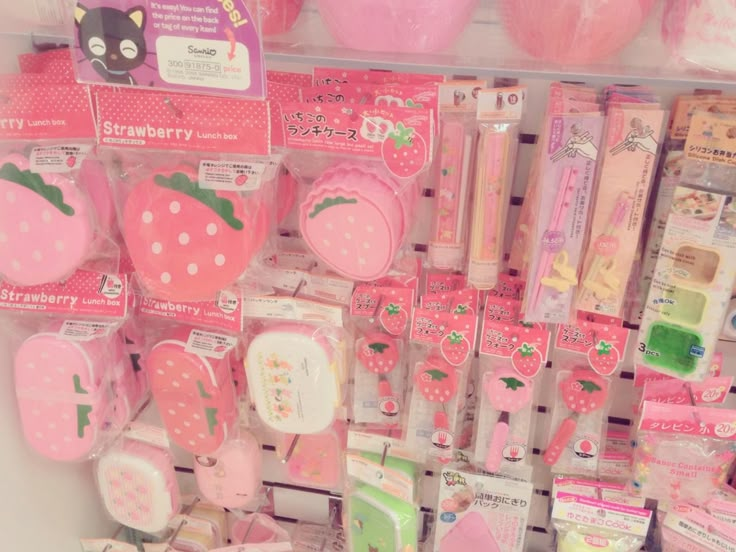 there are many different items on display in the store, including strawberry shaped utensils