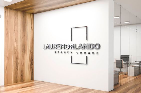 an office with wood flooring and white walls that says laurenoplando beauty lounge