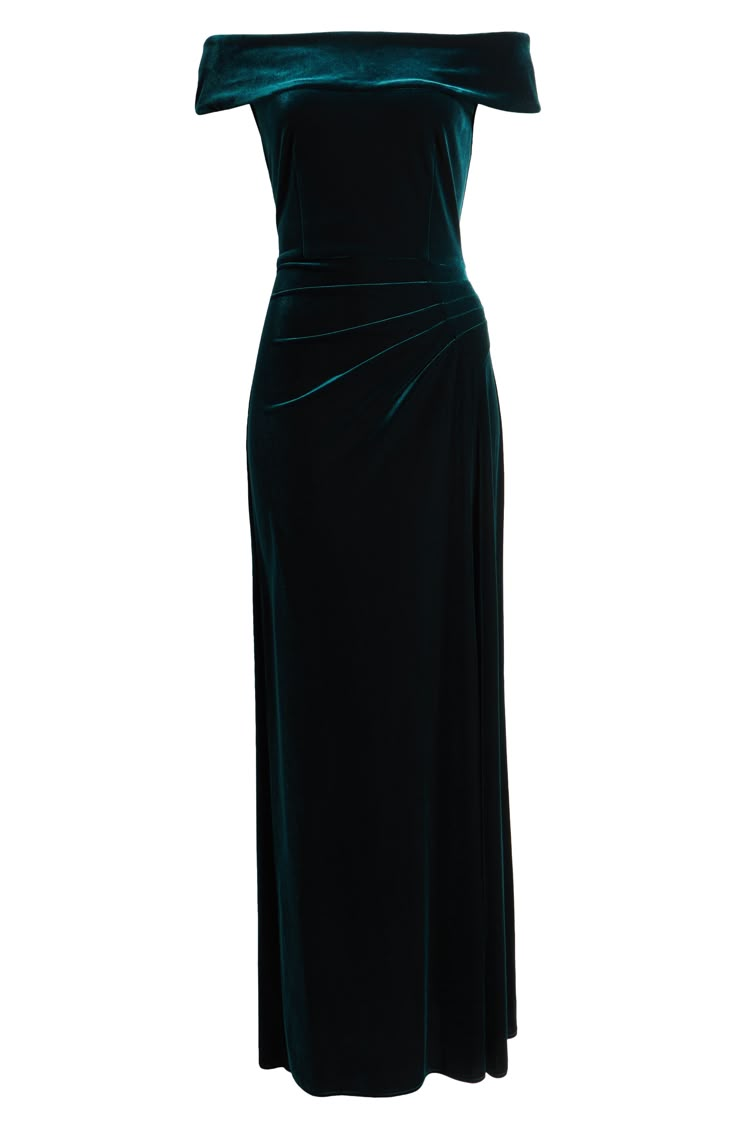 a green velvet dress with an off the shoulder neckline and side slit, on a white background