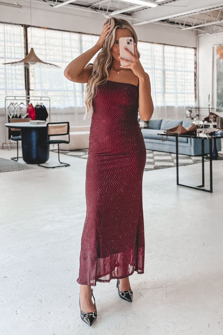 The color of the season & it's a stunning maxi dress?! Oh she is STYLISH!! Burgundy sleeveless studded maxi dress, fitted, has some stretch, dress is lined Material is Nylon Hang to dry Model is 5'5 wearing a small SHOP THE LOOK Sleeveless Maxi Dress For Date Night Holiday, Sleeveless Maxi Dress For Holiday Date Night, Sleeveless Holiday Maxi Dress For Date Night, Chic Fall Maxi Dress For Prom, Sleeveless Maxi Dress For Night Out Holiday, Sleeveless Holiday Maxi Dress For Night Out, Sleeveless Midi Dress For Holiday Party In Spring, Fitted Sleeveless Midi Dress For Holiday Party, Sleeveless Dresses With Side Slits For Party Season