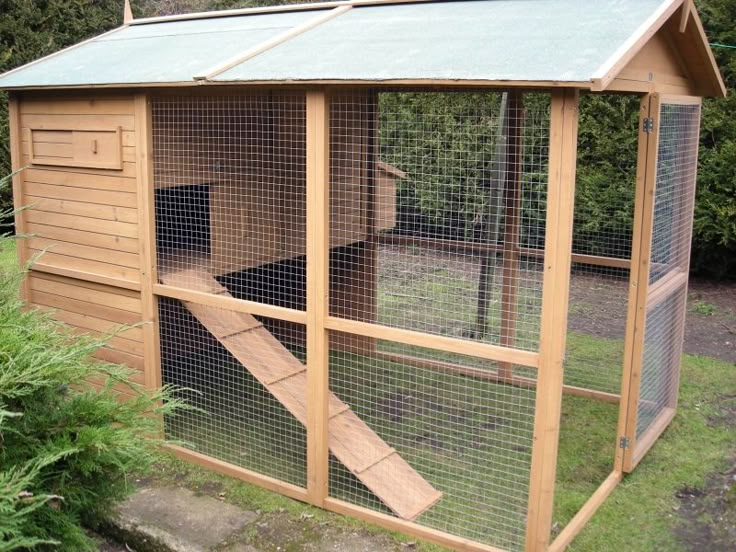 a chicken coop with a run down roof