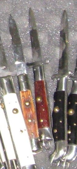 several knives are lined up next to each other