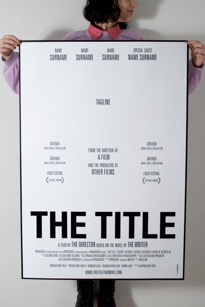 a man holding up a large poster with the title'the title is written on it