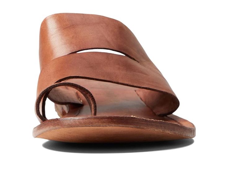 Featuring wide straps on the upper, the Free People™ Abilene Top Loop Sandal offers a unique look..Leather upper, lining, and insole..Slide-on style with toe loops..Open round toe..Flat silhouette..Cushioned footbed with branding detail..Leather outsole..Imported..Product measurements were taken using size EU 39 (US Women's 9), width M. Please note that measurements may vary by size..Measurements: Heel Height: 3/4 in Weight: 7 oz Casual Adjustable Toe Loop Slides, Summer Double Strap Mules With Leather Footbed, Summer Toe Loop Sandals With Adjustable Straps, Spring Slides With Leather Sole, Summer Leather Mules With Rubber Sole, Leather Sole Slides For Spring, Chic Brown Slides With Leather Footbed, Casual Toe Loop Mules For Spring, Double Strap Beach Slides With Leather Footbed