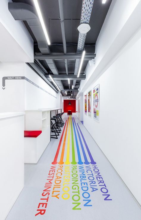 an office hallway with colorful lines painted on the floor