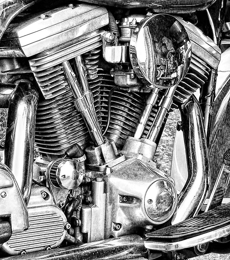 the front end of a motorcycle parked in a parking lot