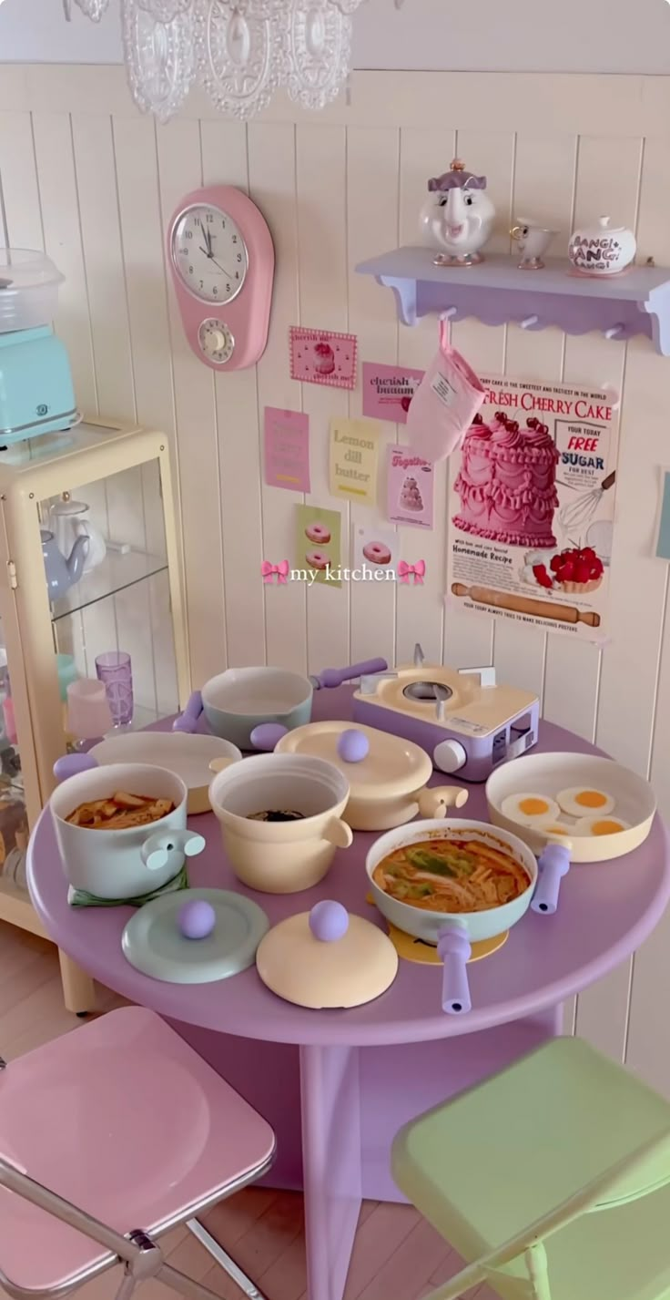 there is a table with many bowls and plates on it in the dining room area