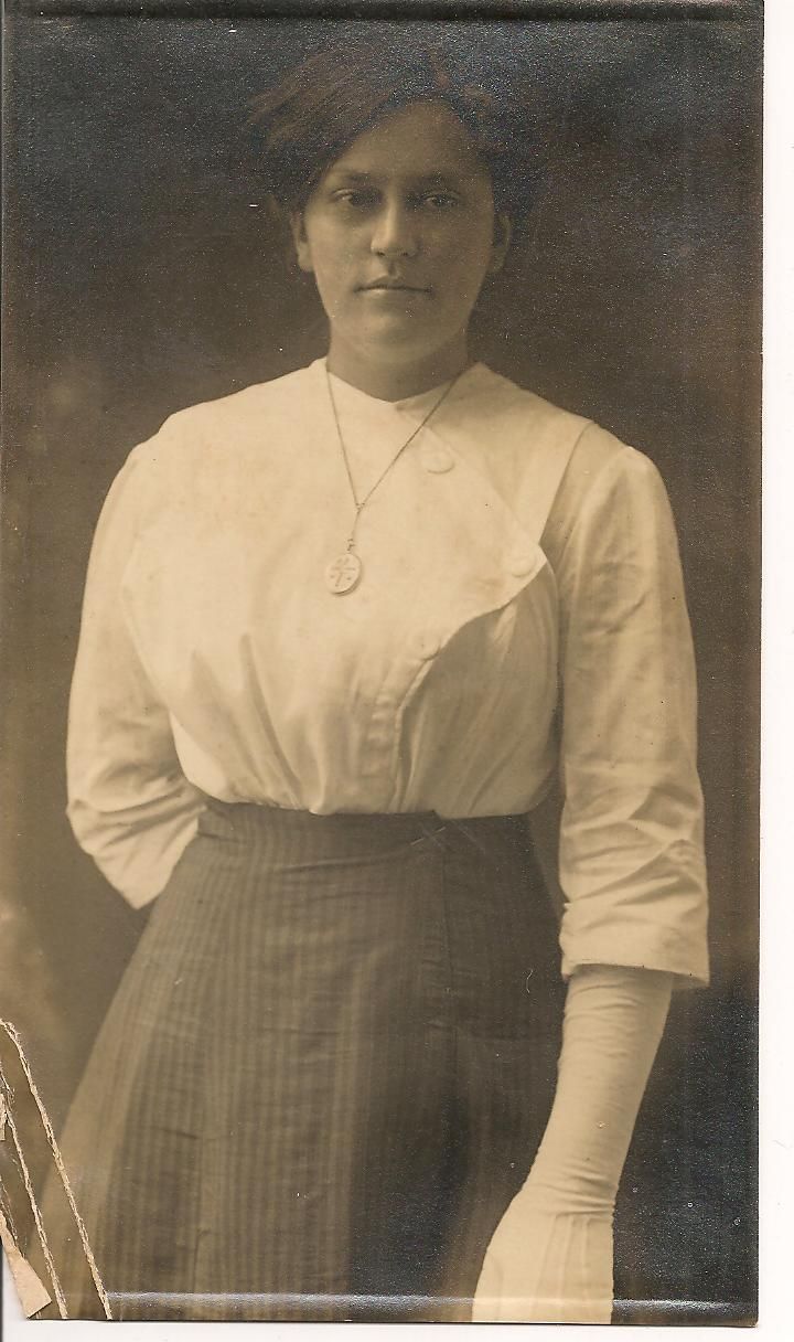 an old black and white photo of a woman