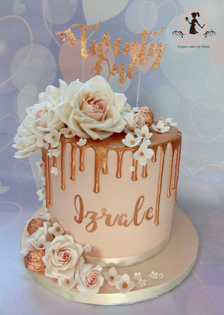 a birthday cake decorated with flowers and icing