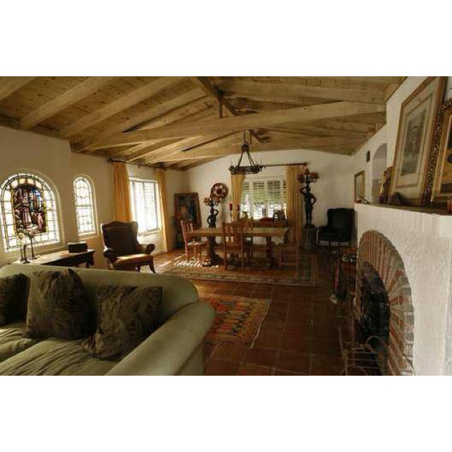 a living room filled with furniture and a fire place