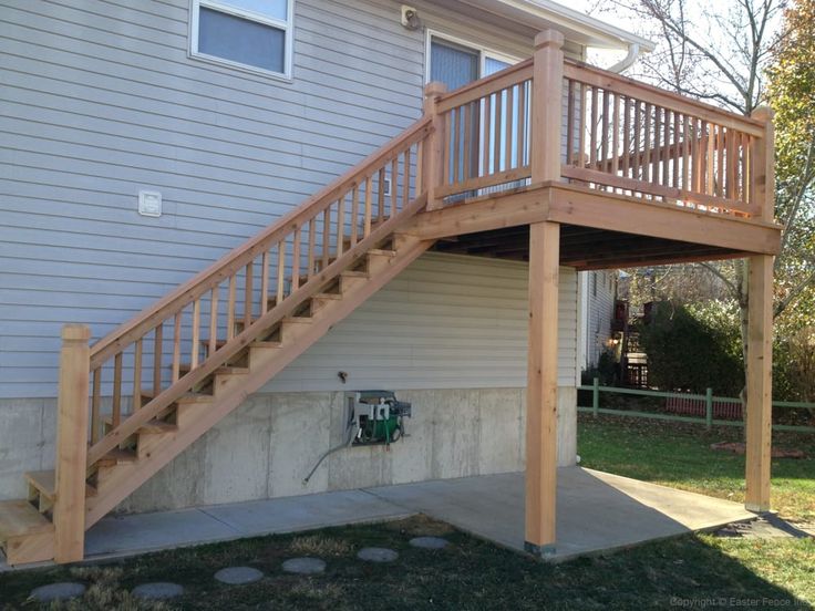 a wooden staircase leading up to a house