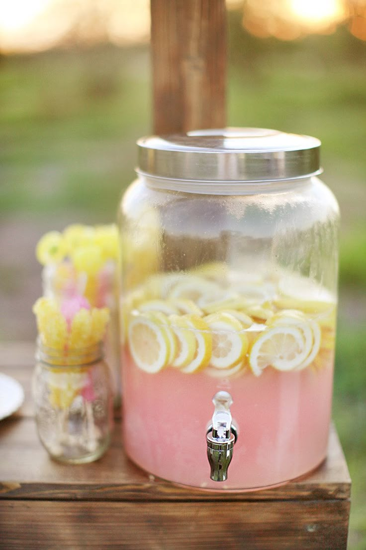 a collage of photos with lemons and cake in jars on the table outside