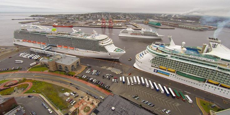 two cruise ships are docked in the harbor