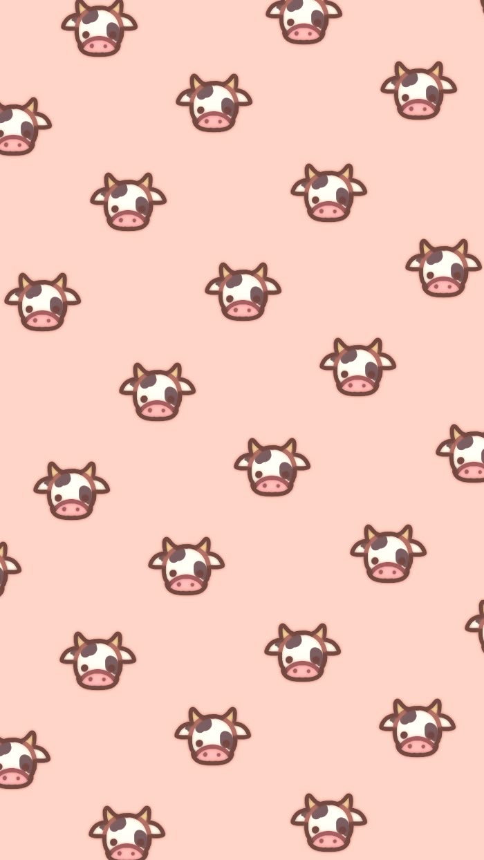 a cow pattern is shown on a pink background