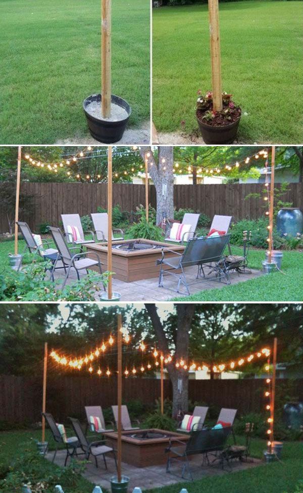 an outdoor fire pit surrounded by lawn chairs and string lights in the middle of a yard