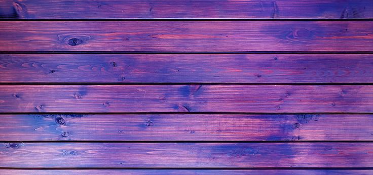 purple wood planks are painted in different shades and sizes, as well as the background