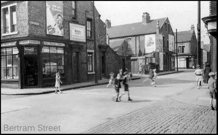 an old black and white photo of children playing in the street