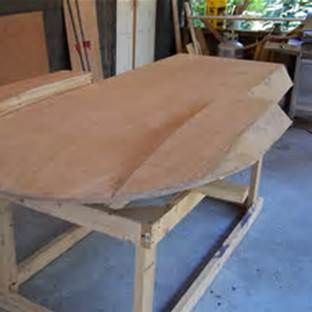 a wooden table being constructed in a shop