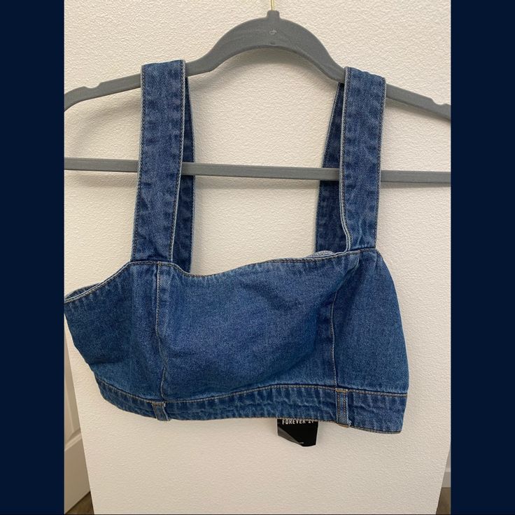 Zippered! Trendy Medium Wash Crop Top, Casual Denim Crop Top, High Rise Denim Crop Top Casual Style, Trendy Light Wash Denim Top, Trendy Medium Wash Denim Crop Top, Trendy Fitted Medium Wash Crop Top, Trendy Dark Wash Crop Top, Cropped Denim Top For Day Out, Casual Denim Blue Crop Top