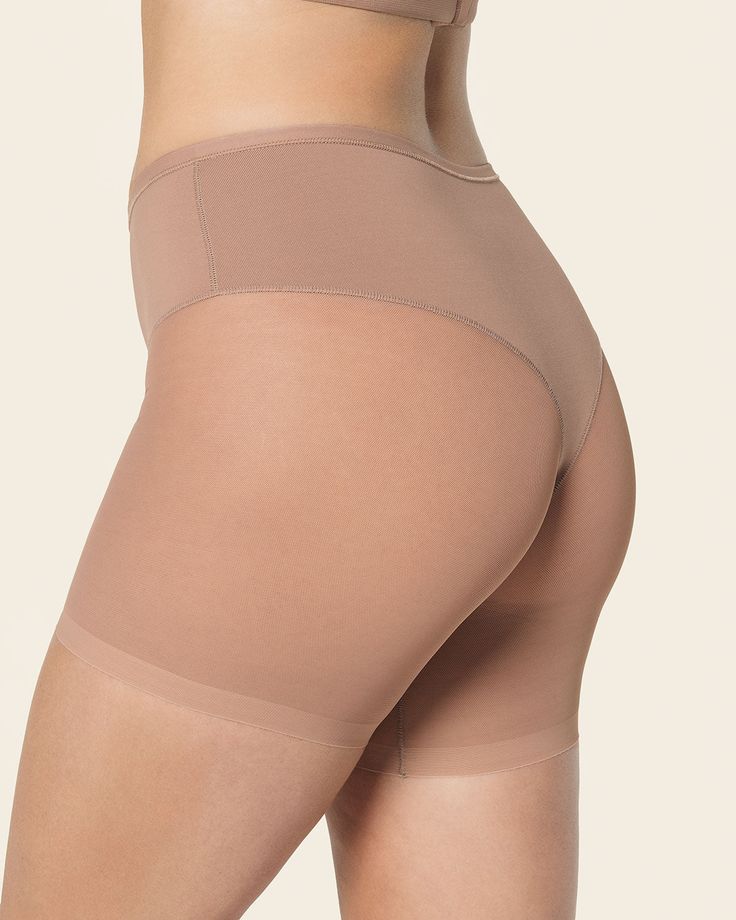 Shape your curves and prevent chafing at the same time! This slip short is made of a super soft and comfy compression fabric to smooth out your tummy and shape your waist. It has a sheer short bottom for an invisible look under clothes, plus this design helps reduce chafing under skirts and dresses. The thong effect in the back offers a light butt-lifting effect. Go ahead and wear this slip short under fitted clothes – it won't show through! Fitted Clothes, Shape Your Waist, Slip Shorts, Leg Bands, Compression Fabric, Everyday Bra, Under Dress, Skirts And Dresses, Design Help