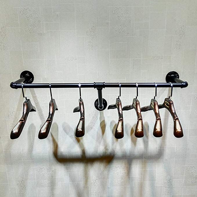 several pairs of shoes hanging on a rack