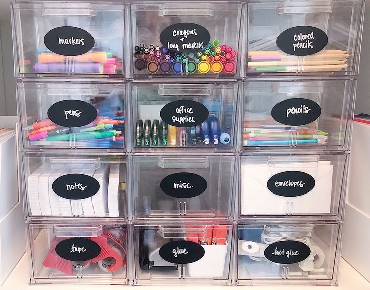 the drawers are organized with markers, markers and pencils in clear plastic bins