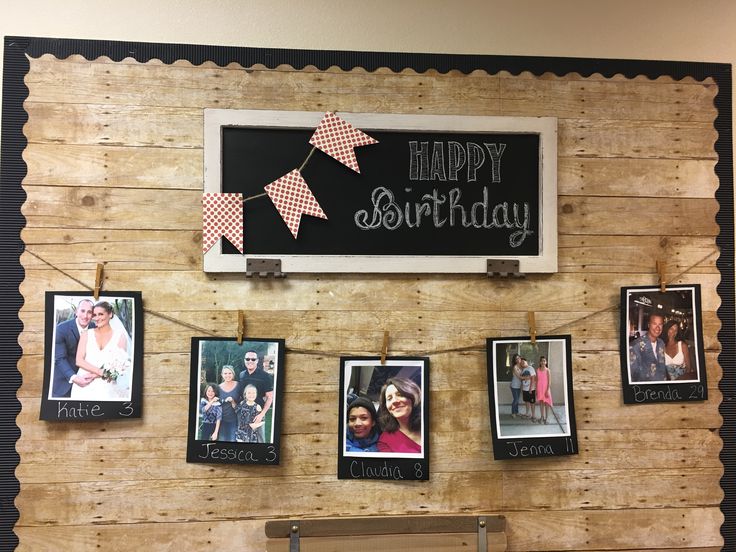 a wooden wall with pictures hanging from it's sides and a sign that says happy birthday