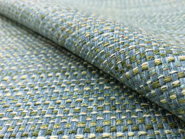 a close up view of a blue and green tweed fabric