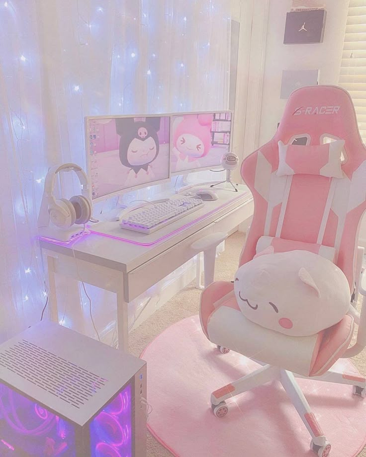 a chair with a pillow on it in front of a computer desk and monitor screen