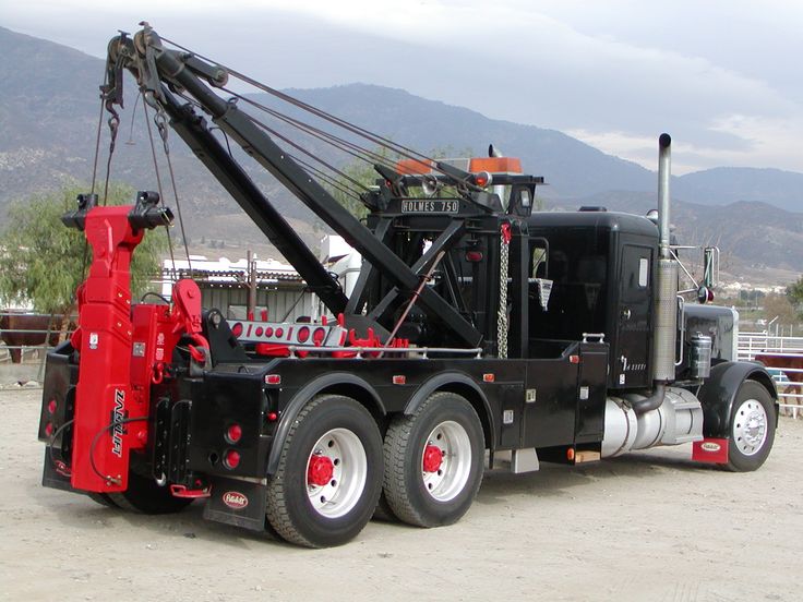 a large truck with a crane attached to it's back