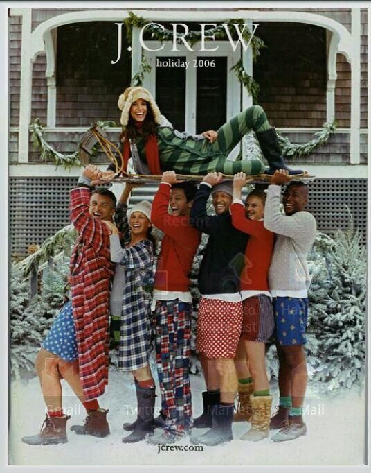 a group of young people standing in front of a house with snow on the ground