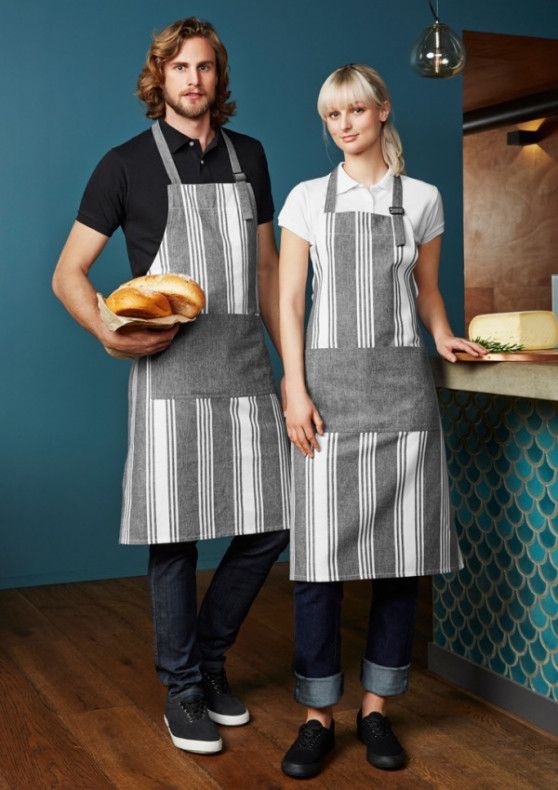 man and woman in aprons holding sandwiches