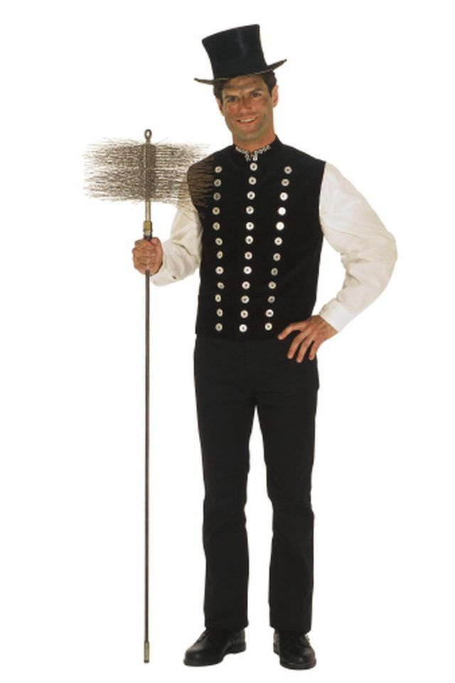 a man in a top hat holding a broom