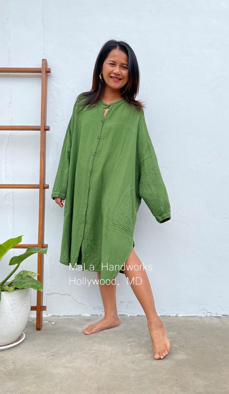 MalaHandworks' shirtdress is differentiated by its quality, crinkle stitched, double gauze fabric that gets softer with time. Generously sized - one size fits most - is very livable and made for wearing at home and away from home. The wide sleeves can be rolled up to your desired length, and the front buttons are quality and well sewn for however many you use. SIZE & FIT INFORMATION * All measurements are flat * Bust/ Waist/ Hips 38 in (Circumference 76 in.) * Length 41 in. * Mock-neck * But Casual Green Long Sleeve Shirt Dress, Green Cotton Shirt Dress For The Beach, Casual Long-sleeved Shirt Dress Relaxed Fit, Casual Solid Relaxed Fit Shirt Dress, Green Long Sleeve Relaxed Fit Shirt Dress, Relaxed Fit Long Sleeve Casual Shirt Dress, Casual Long Sleeve Shirt Dress Relaxed Fit, Green Relaxed Fit Long Sleeve Shirt Dress, Oversized Long Sleeve Green Shirt Dress