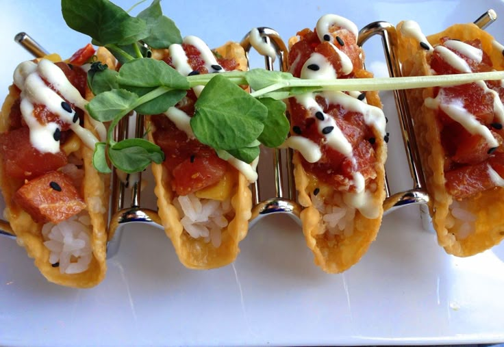 small appetizers with meat, cheese and sauce on them