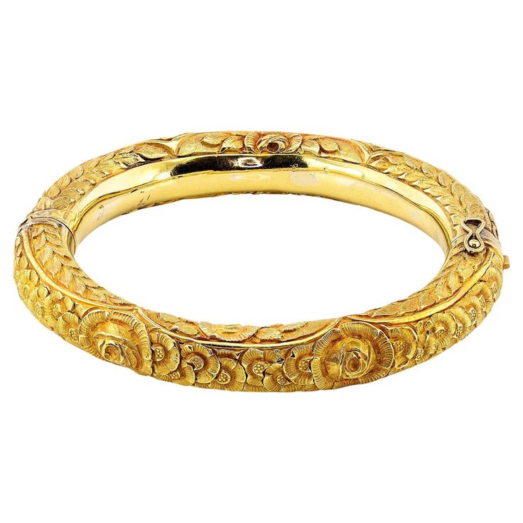 This marvellous antique Art Nouveau period hinged bangle is 1890 circa - Italian origin Entirely hand crafted of solid 18 Kt gold, marked and verified electronically testing – please note nothing of this bangle has been made by machine Rare hollow work richly detailed with budding leaves and flowers brought to life in a complex intricate design to distinguish the harmonious vision of the Art Nouveau era, detailed with hand carving for depth and texture finishing to the beautiful art work Bangle' Diamond Locket, Gemstone Art, Fancy Yellow Diamond, Antique Bracelets, Wire Bangles, Diamond Bangles Bracelet, Gold Art Deco, Diamond Bangle, Gold Art