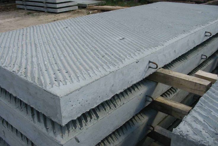 several cement blocks stacked on top of each other in the middle of a construction site