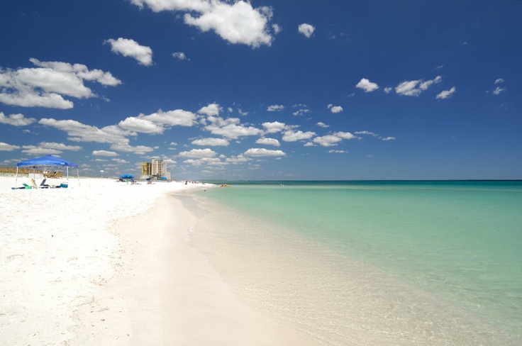 the beach is clean and clear for people to enjoy in it's white sand