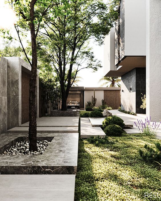 an outdoor courtyard with grass and trees