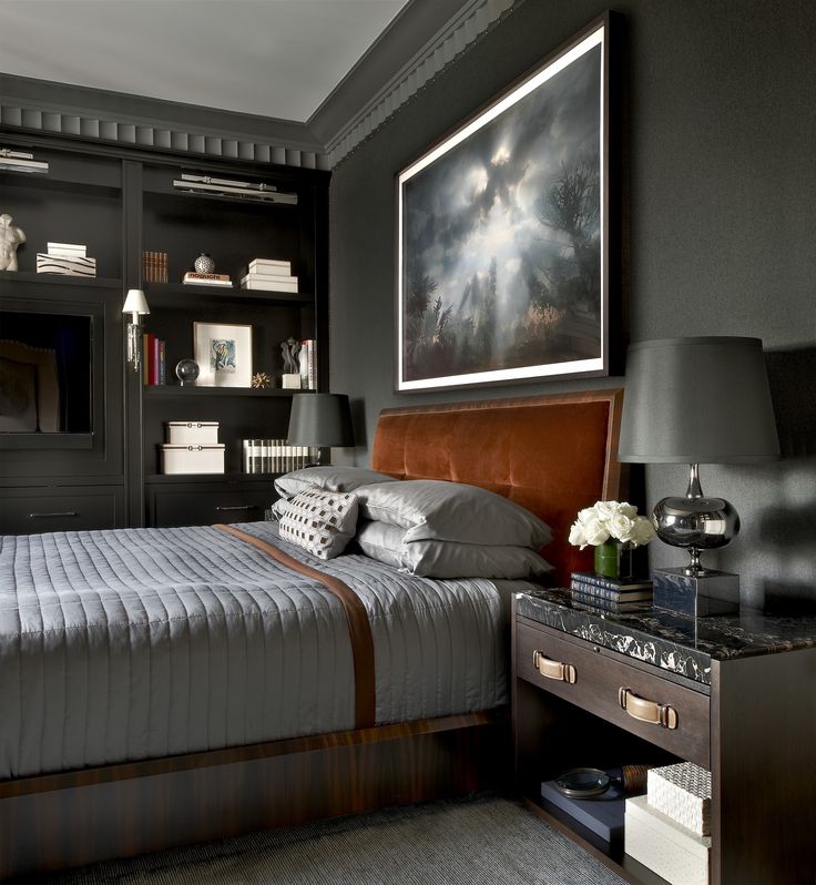 a bed sitting in a bedroom next to a book shelf