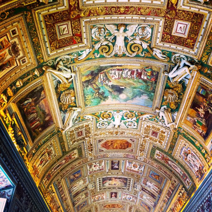 an ornate ceiling with paintings on it