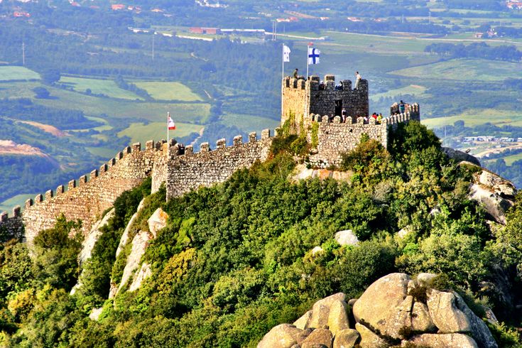 an old castle on top of a mountain