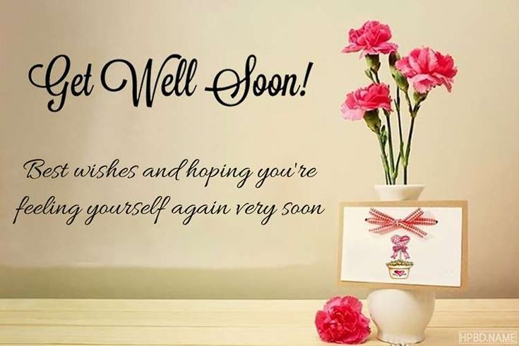 pink carnations are in a vase next to a card with the words get well soon