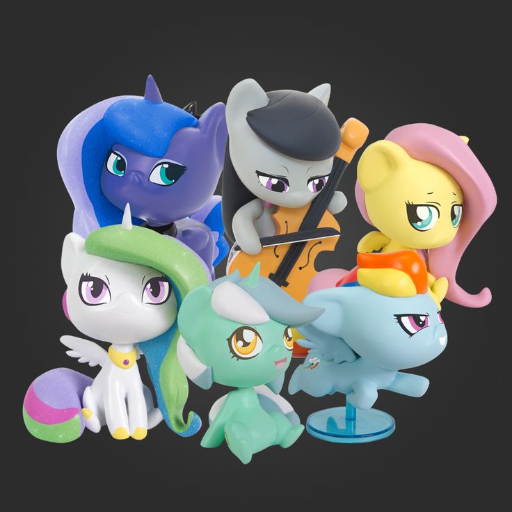 the little ponys are all lined up together in this photo, and one is wearing a hat