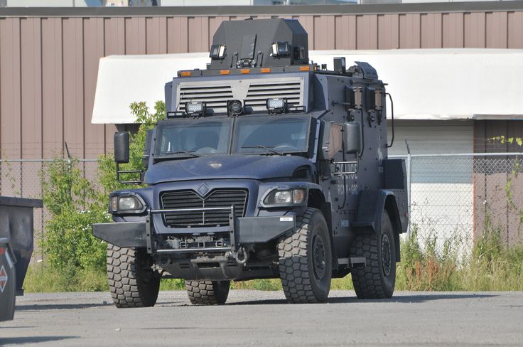 an armored vehicle parked in front of a building