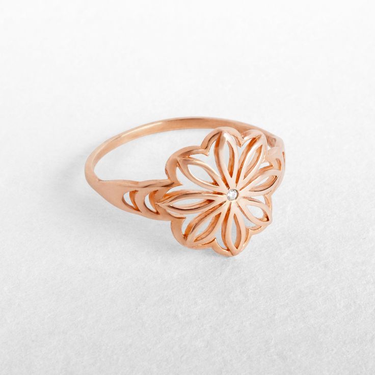 "A unique rose gold floral ring with a delicate clear or black diamond. Handcrafted craftsmanship at it's best - 100% Top quality Gold, 100% handcrafted for each and every customer. Maya Mor Jewelry is dedicated to contemporary and avant-garde jewelry and to one-of-a-kind pieces that are personally designed and created by Maya. The jewels are handmade with skillful goldsmithing work and advanced technologies, comfortable to wear due to their ergonomic shapes, and carefully finished with the pass Gold Diamond Flower Promise Ring, Gold Diamond Flower Ring For Promise, Gold Diamond Flower Ring For Anniversary, Gold Heirloom Jewelry In Flower Shape, Heirloom Gold Jewelry With Flower Shape, Heirloom Gold Jewelry In Flower Shape, Flower Shaped Yellow Gold Diamond Ring As A Gift, Gold Flower-shaped Ring For Gift, Gold Flower-shaped Diamond Ring