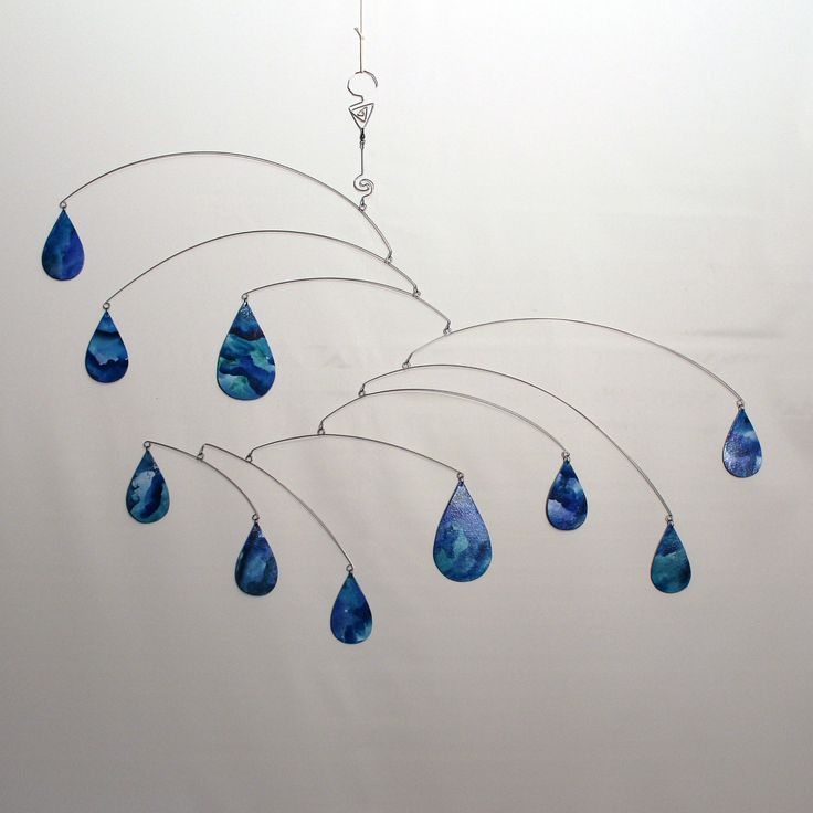 a wind chime with blue glass tears hanging from it