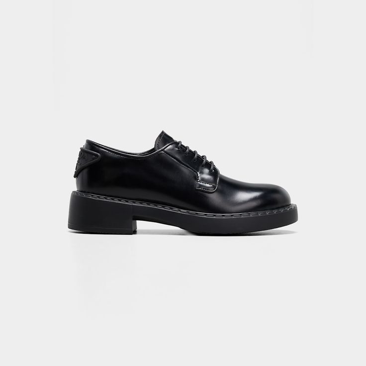 Prada derby loafers in calf leather 2.00 in / 50 mm flatform heel Almond toe Lace-up vamp Logo triangle at back  Leather/rubber outsole Made in Italy Elegant Slip-on Oxfords With Contrast Sole, Elegant Lace-up Shoes With Lug Sole For Work, Leather Low-top Platform Loafers For Formal Wear, Formal Leather Low-top Platform Loafers, Formal Low-top Leather Platform Loafers, Luxury Lace-up Shoes With Lug Sole For Work, Classic Low-top Leather Platform Loafers, Luxury Loafers With Contrast Sole For Work, Casual Patent Leather Oxfords For Business