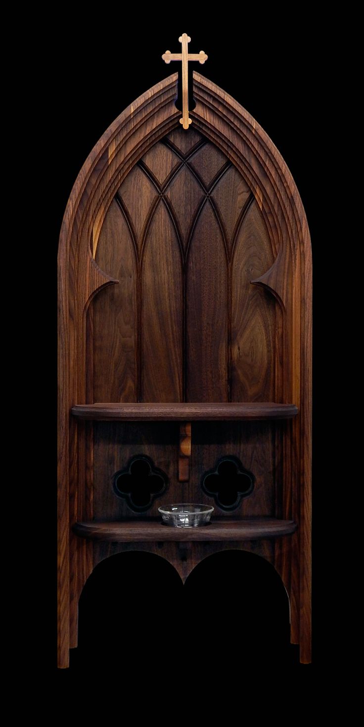 a wooden shelf with a cross on top